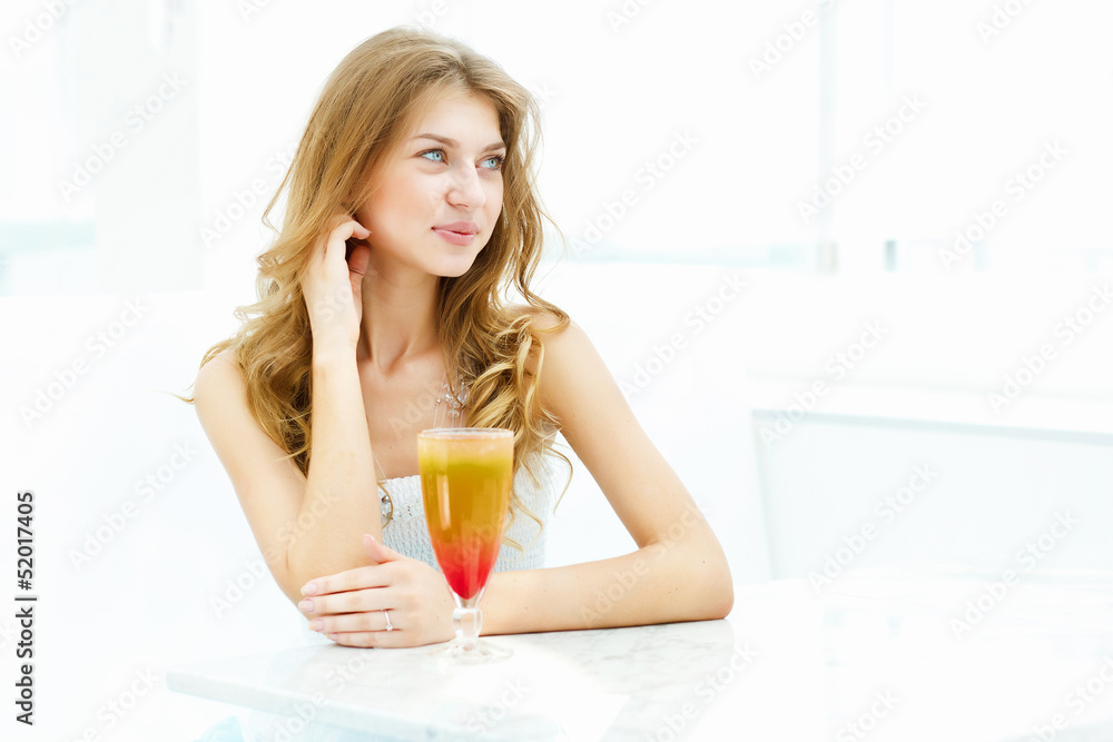Young woman with a glass of drink Young woman with a glass of drink