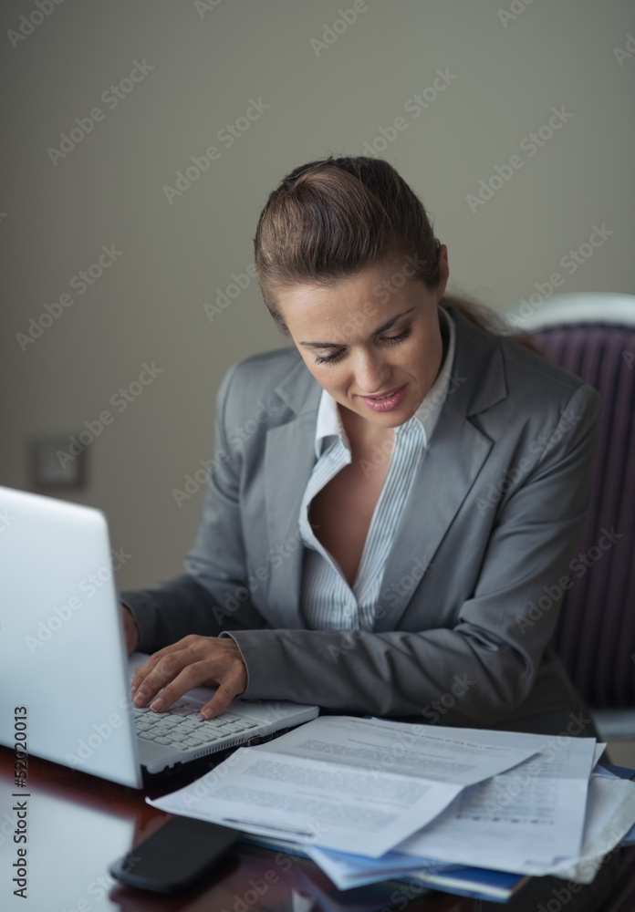 Business woman working with documents and laptop Business woman working with documents and laptop
