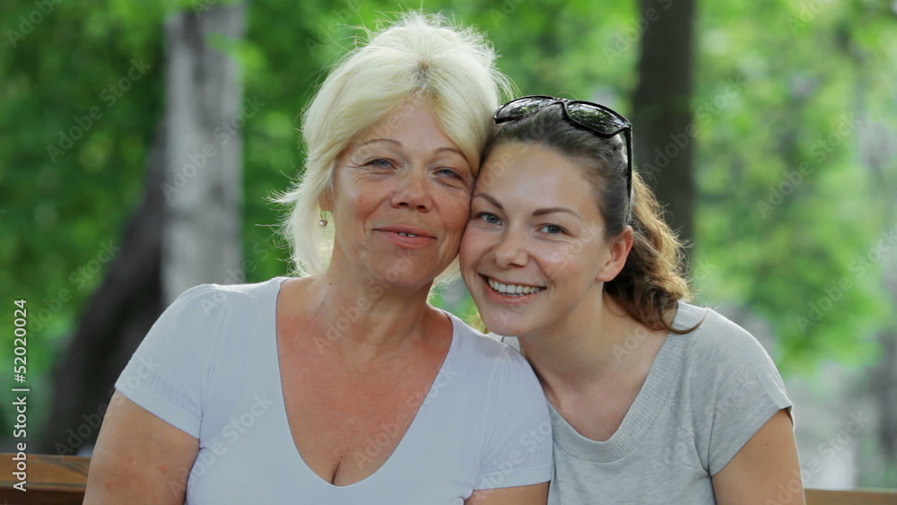 beautiful mother and daughter hugging and laughing beautiful mother and daughter hugging and laughing
