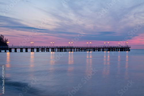 Sunrise on the pier at the seaside, Gdynia Orlowo, Poland. © R_Szatkowski