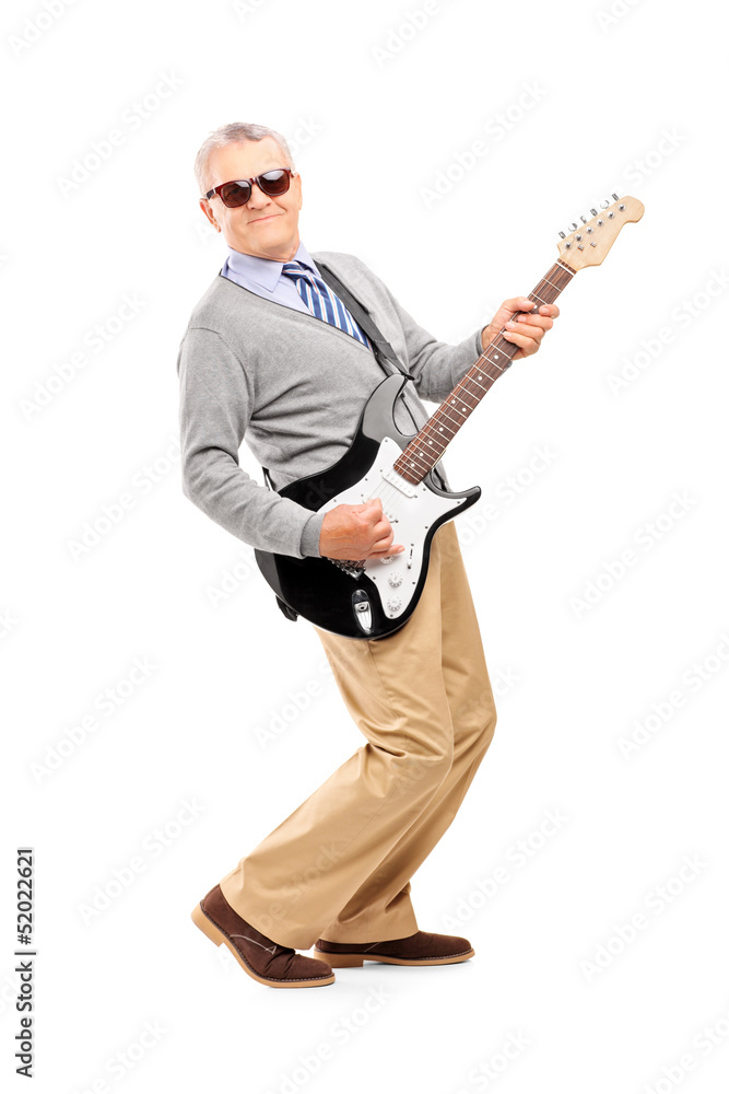 Full length portrait of a smiling mature man playing guitar Full length portrait of a smiling mature man playing guitar