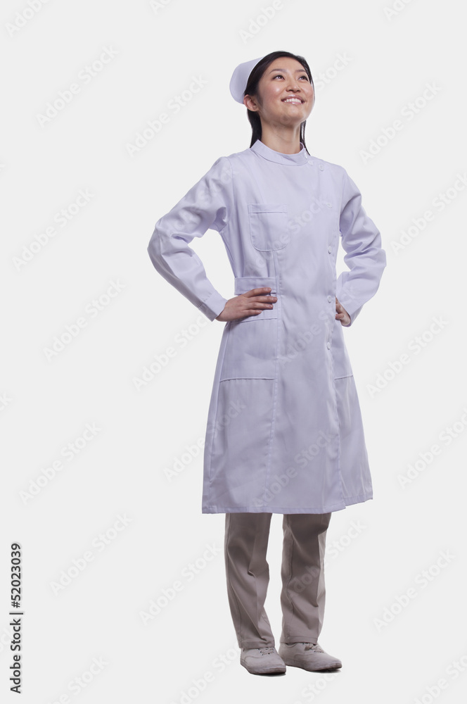 Portrait of Nurse with hands on hips, Studio shot Portrait of Nurse with hands on hips, Studio shot