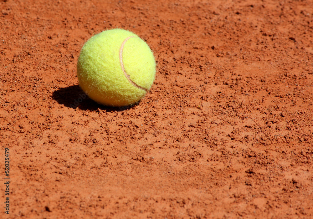 close up of ball lying on tennis court