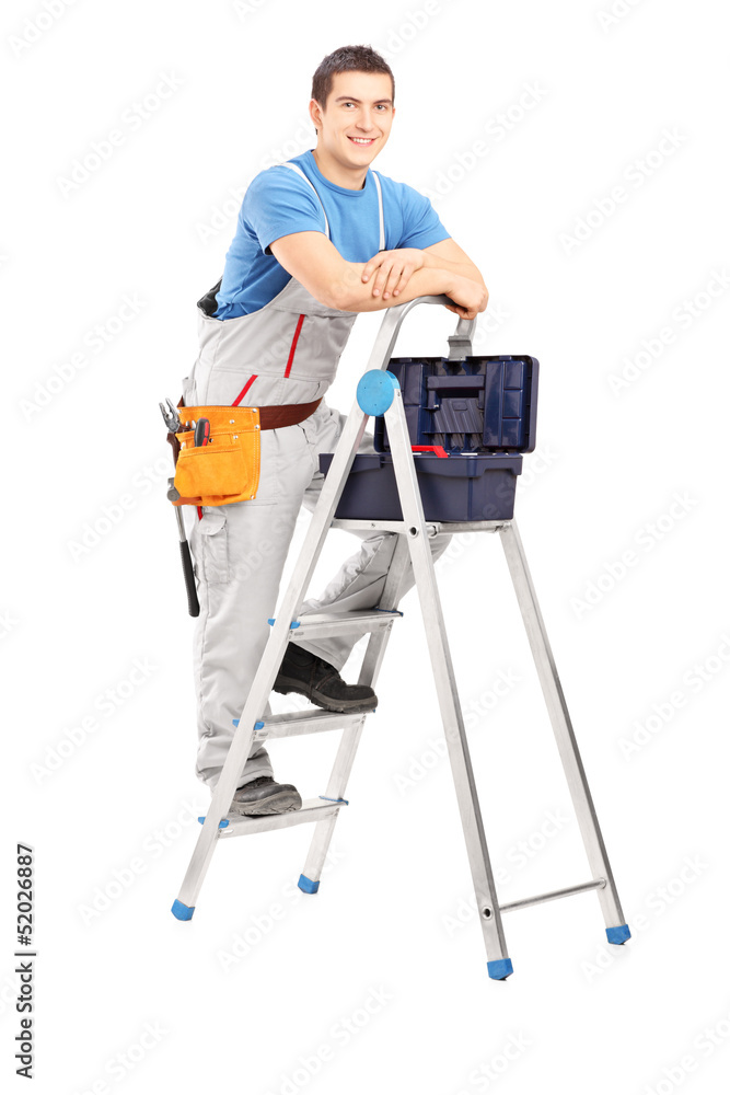 Full length portrait of a handy man posing on a ladder Full length portrait of a handy man posing on a ladder