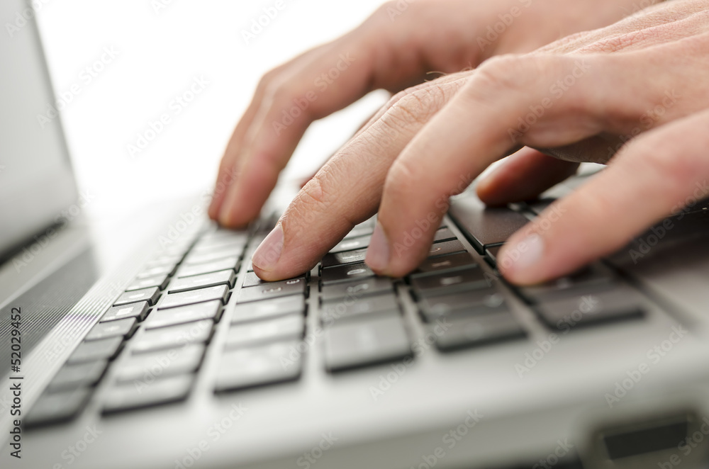 Businessman hands typing on laptop keyboard Businessman hands typing on laptop keyboard