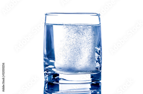 Two tablet in glass of water