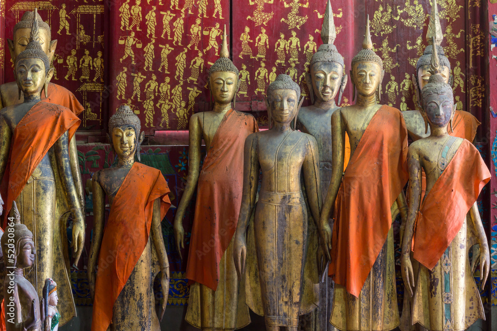 A group of buddha statues (standing)
