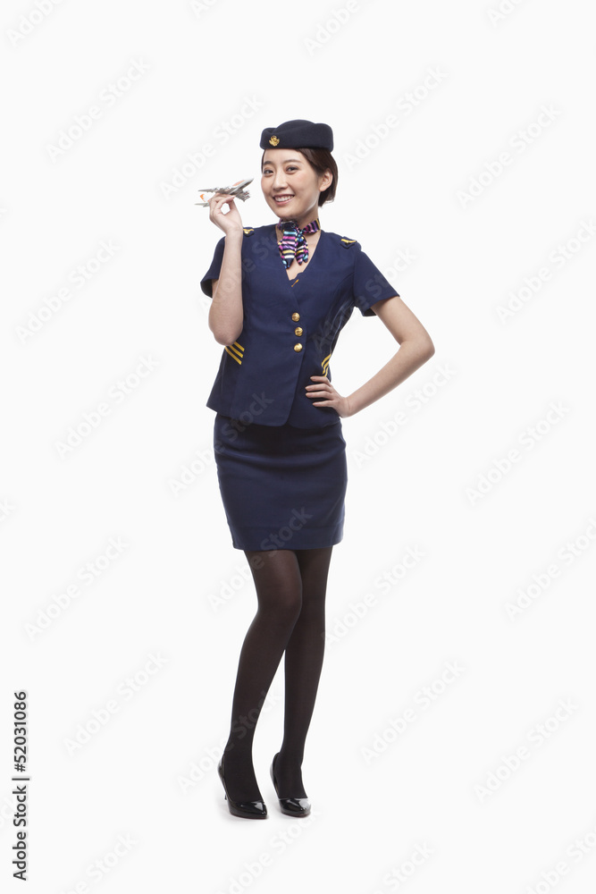 Portrait of Air Stewardess Holding Model Airplane Portrait of Air Stewardess Holding Model Airplane
