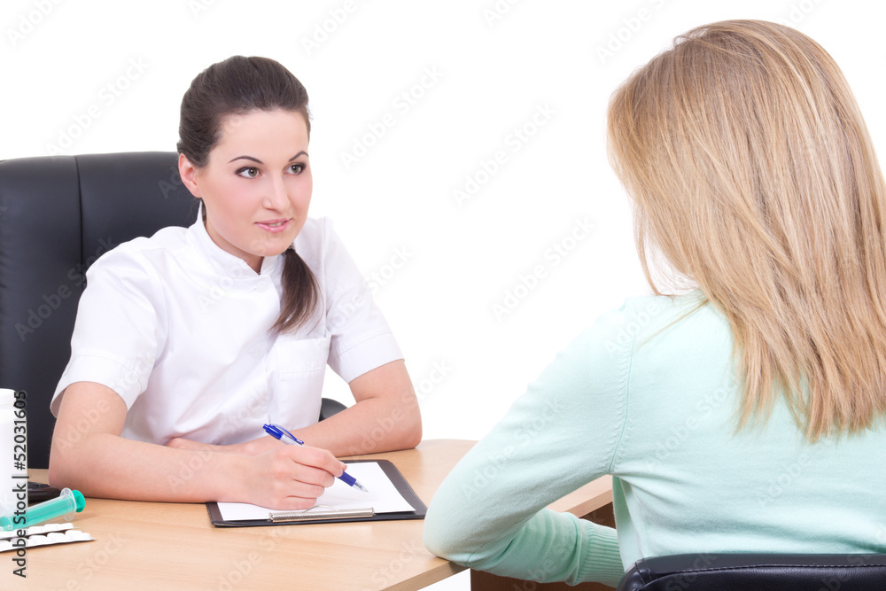doctor talking with patient in doctors office