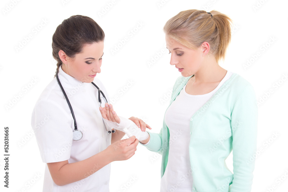 young doctor bandaging female hand over white background young doctor bandaging female hand over white background