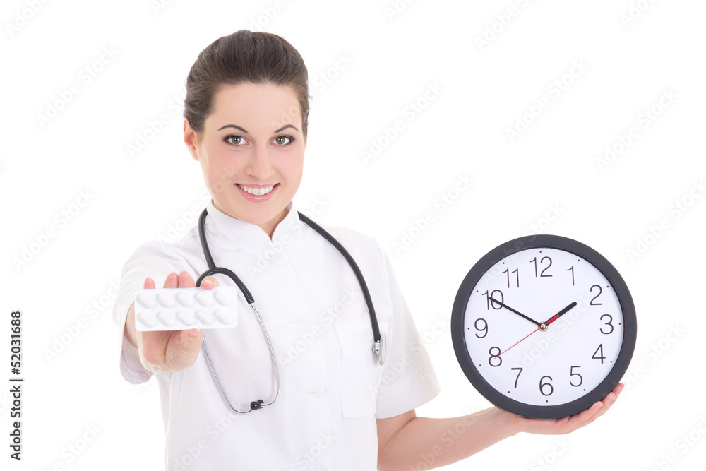 young female doctor with pills and clock over white young female doctor with pills and clock over white