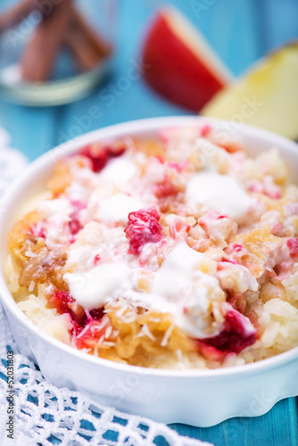 Rice pudding with applem raspberry and cinnamon