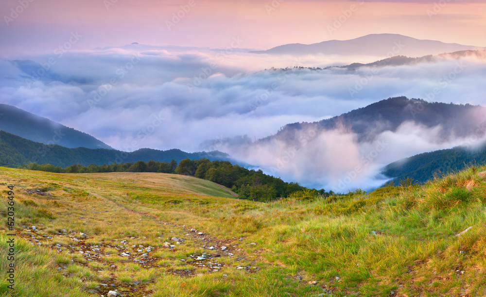 Misty sunset in the mountains. Misty sunset in the mountains.