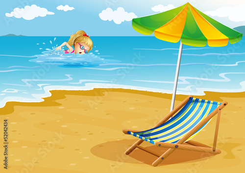 A girl swimming at the beach with a chair and an umbrella at the