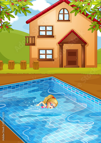 A girl swimming at the pool