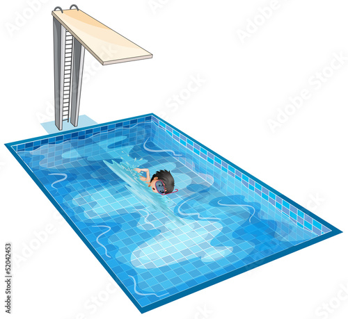 A boy swimming at the pool