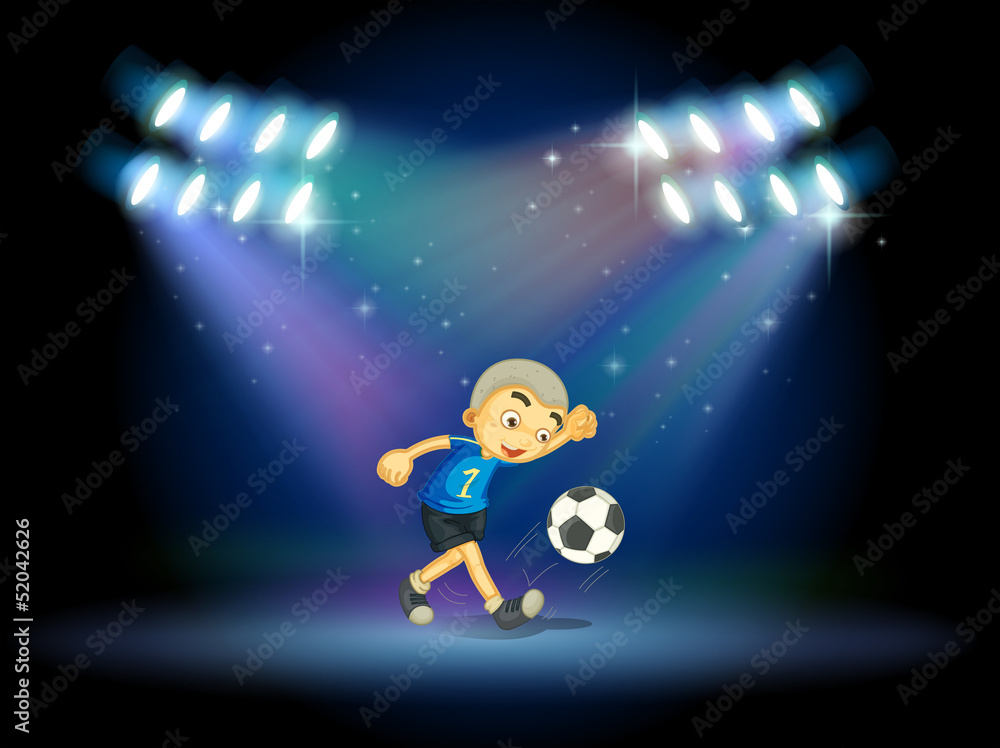 Fototapeta premium A young football player at the stage