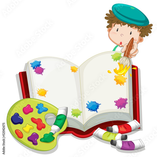 A boy painting a book