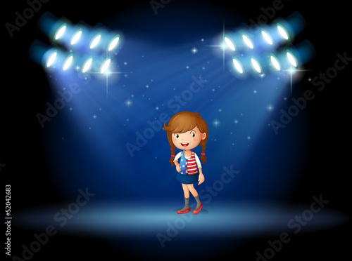 A young girl with a long hair at the stage