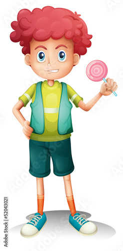 A boy holding a lollipop