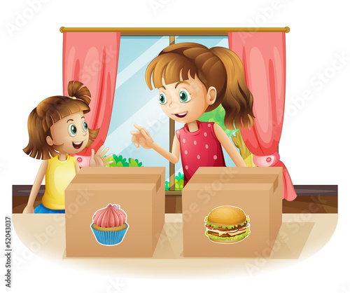 A woman and a young girl near the two boxes