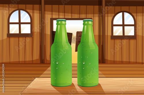 Two green bottles above the table