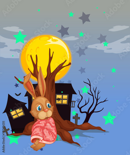 A rabbit beside an old tree