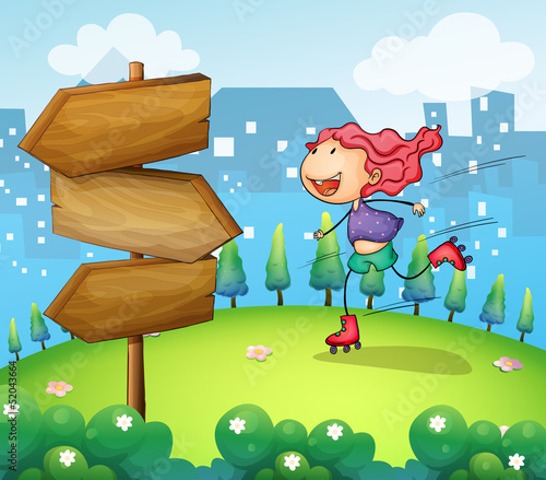 A girl skating in the garden with a wooden arrow board