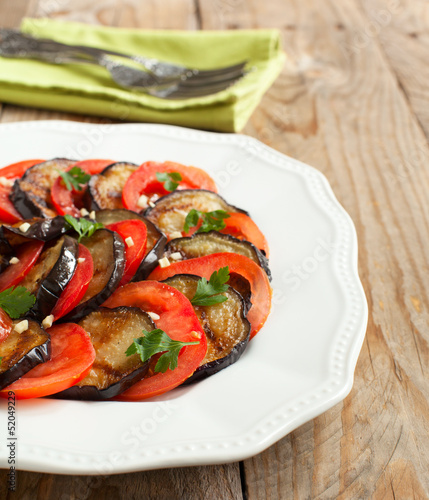 Roasted eggplants with fresh tomatoes and garlic