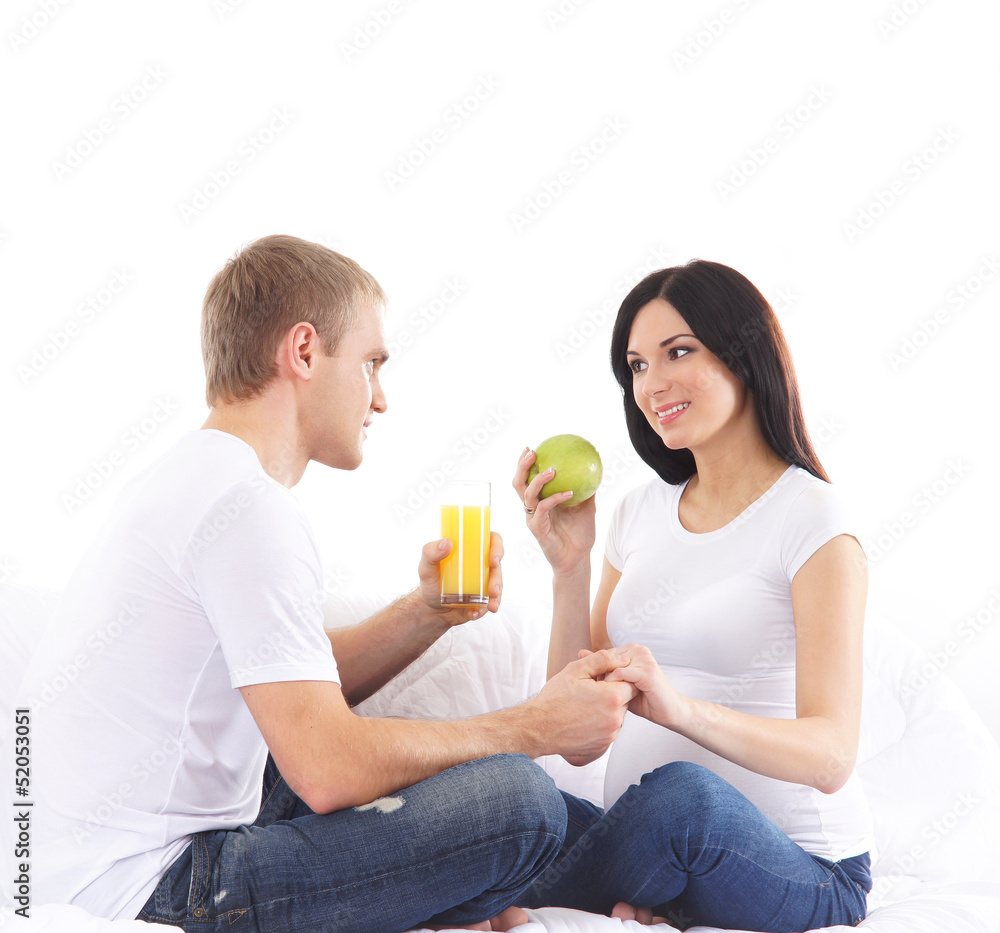 Young attractive couple: pregnant mother and happy father Young attractive couple: pregnant mother and happy father