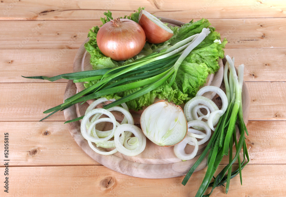 Composition with herbs and onions on wooden table Composition with herbs and onions on wooden table
