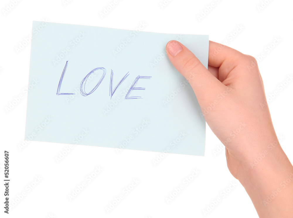 Love word on piece paper in hand isolated on white Love word on piece paper in hand isolated on white