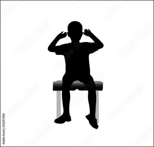 boy sitting on  chair with hands up