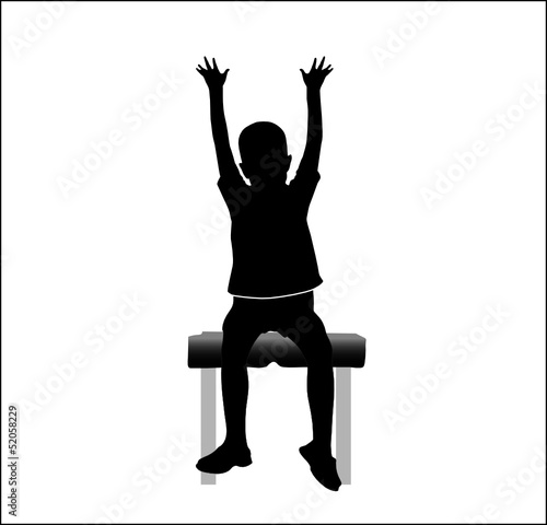 boy sitting on chair with hands up