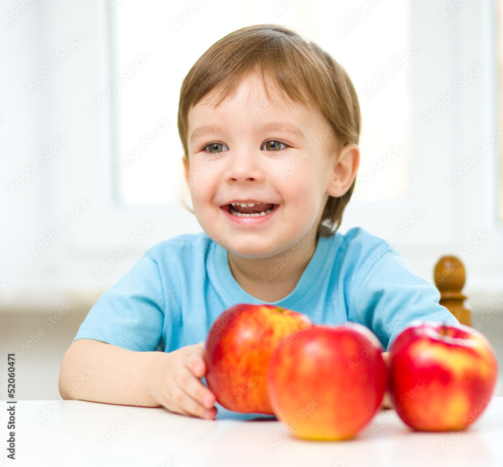 Portrait of a happy little boy with apples Portrait of a happy little boy with apples