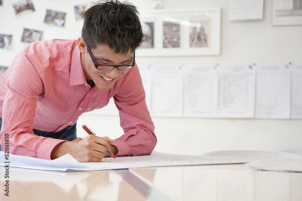 Businessman working on architecture project in the office Businessman working on architecture project in the office