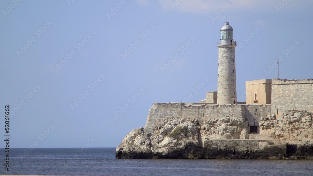 Lighthouse and Morro castle in La Habana, Cuba, with sea Lighthouse and Morro castle in La Habana, Cuba, with sea