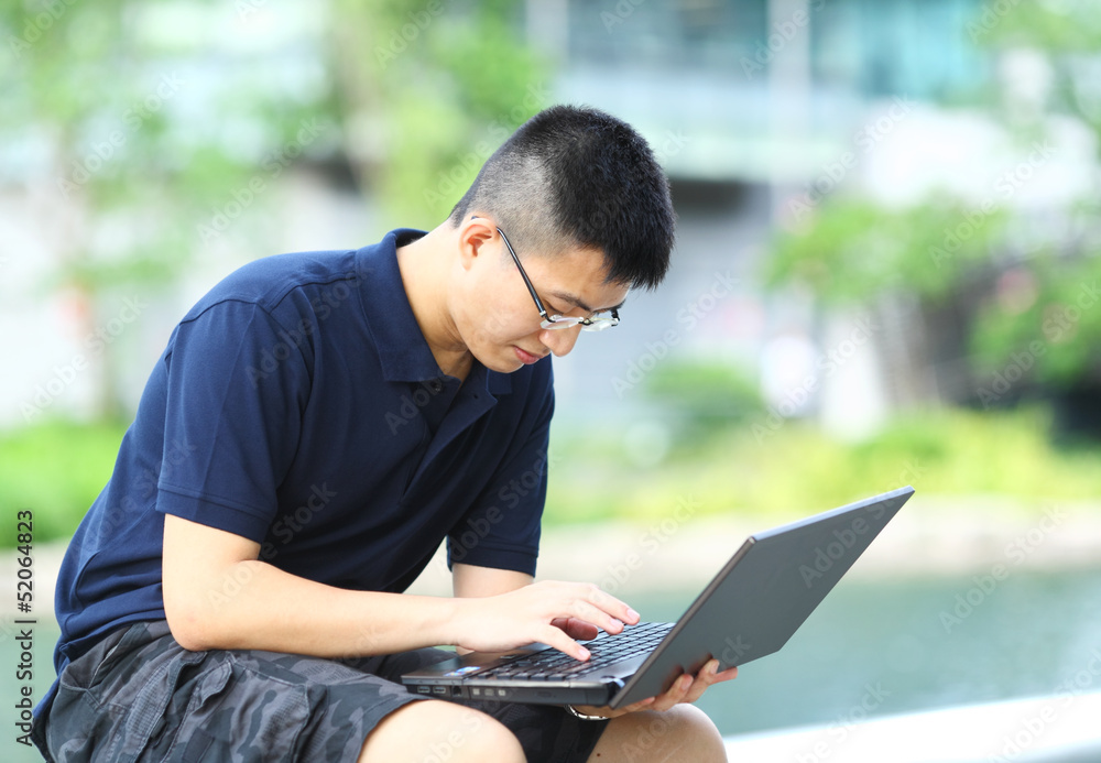 man using computer outdoor