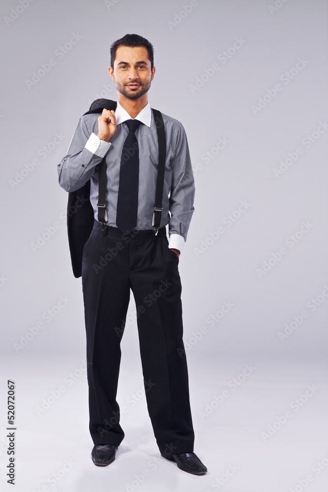 Young Manager Holding A Coat Over His Shoulder Young Manager Holding A Coat Over His Shoulder