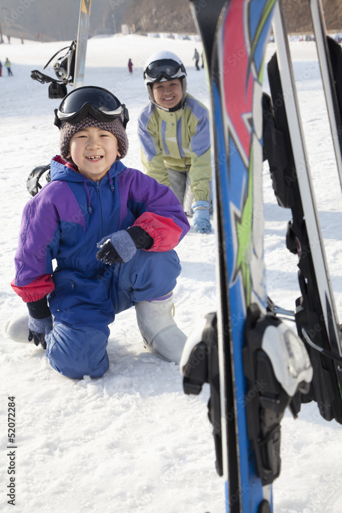 Mother and Son Smiling in Ski Resort