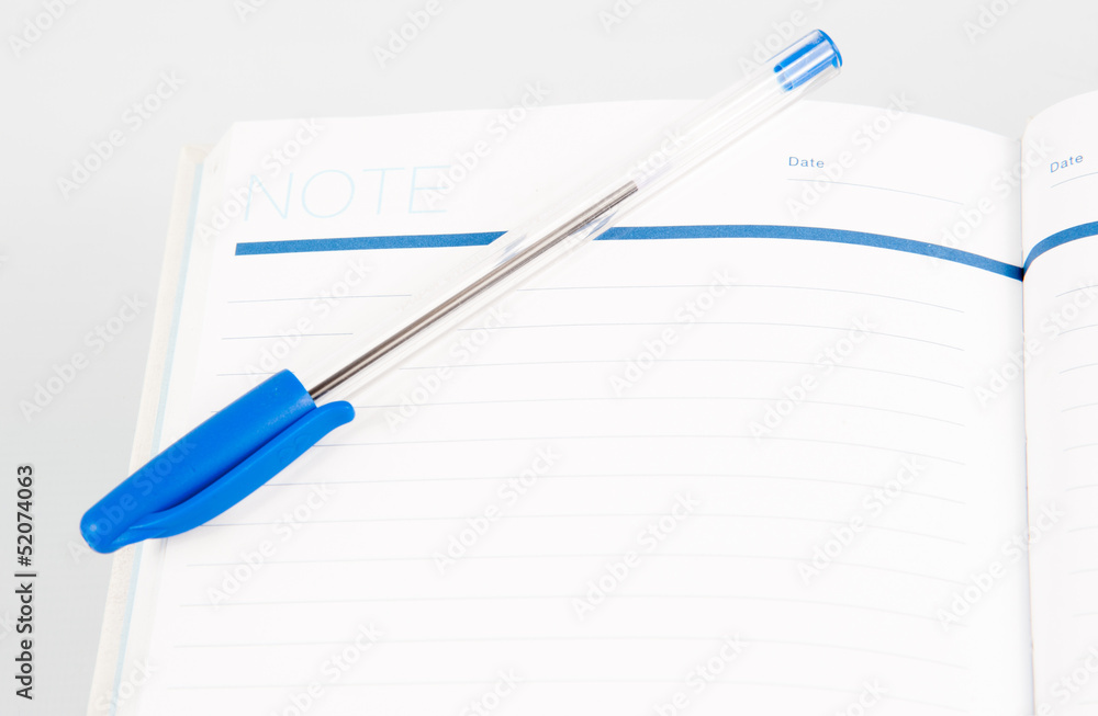 Open note book with lined pages free date space and ballpoint pe Open note book with lined pages free date space and ballpoint pe