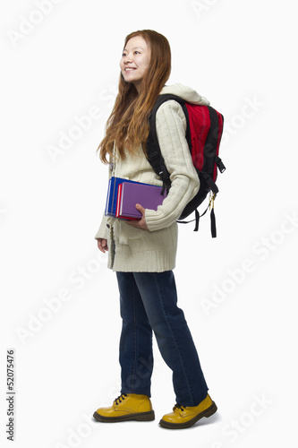 Smiling female student walking