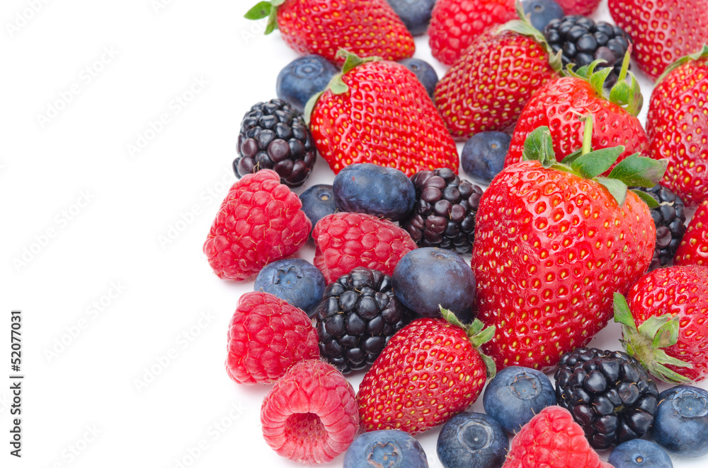 Close-up of assorted fresh berries isolated on a white Close-up of assorted fresh berries isolated on a white