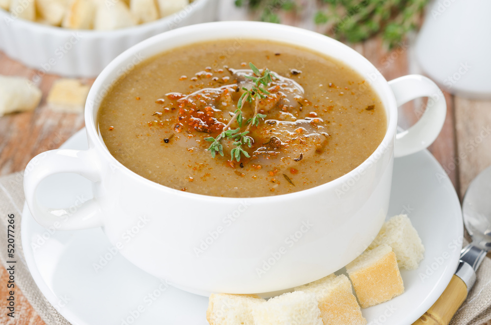 mushroom soup with thyme and croutons horizontal close-up mushroom soup with thyme and croutons horizontal close-up