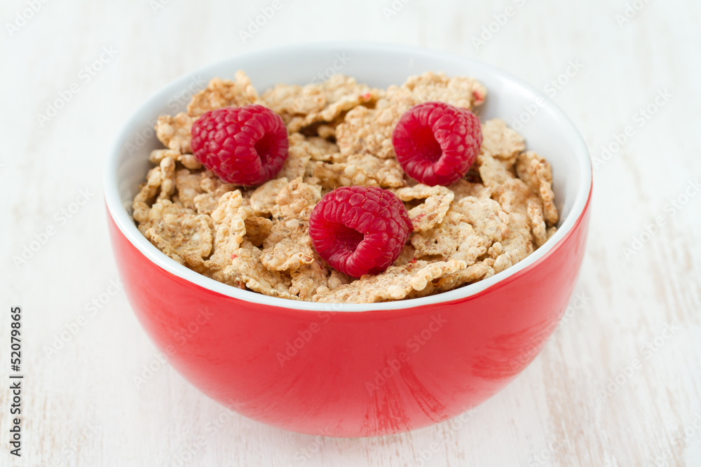flakes with fresh berries in red bowl flakes with fresh berries in red bowl