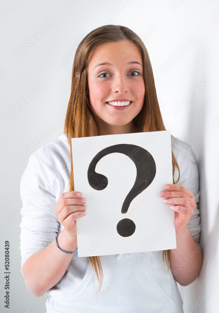 Portrait of happy student with question mark sign at campus Portrait of happy student with question mark sign at campus