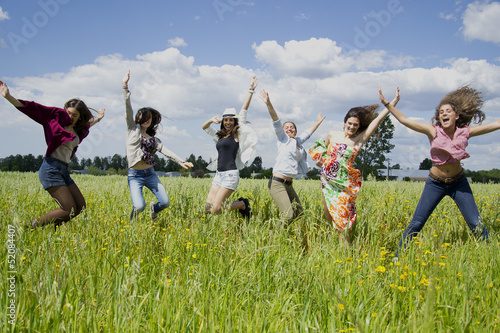 Young women jumping with joy