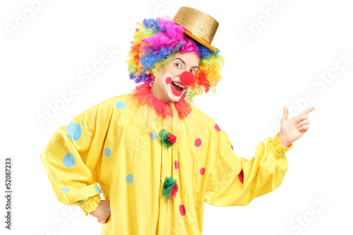 A cheerful clown in a yellow costume