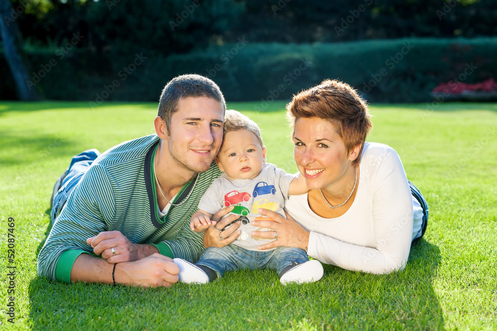 Fototapeta premium Family playing on grass