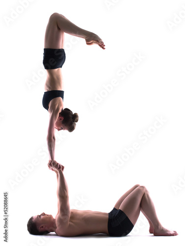 Image of young flexible people showing acrobatics